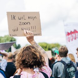 Amsterdam, The Netherlands - 12 September 2021: Woonprotest demonstration against housing crisis in Amsterdam, woman wearing sign door etreeg (Shutterstock)