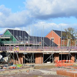 HILPERTON - FEB 21: View of a building site on Feb 21, 2015 in Hilperton, UK. The Wiltshire village is part of the UK's construction boom with the number of new homes being built up 10% since 2013. door 1000 Words (Shutterstock)