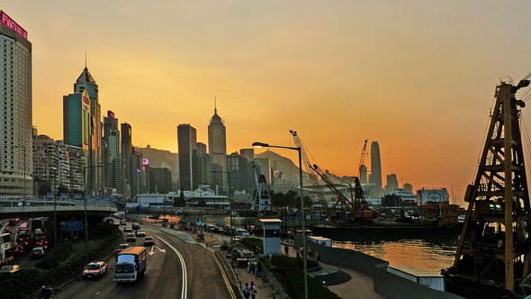 Sunset Causeway Bay Hong Kong." (Public Domain) by Bernard Spragg