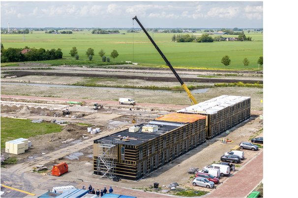Modular housing under construction door Thomas Roell (bron: Shutterstock)